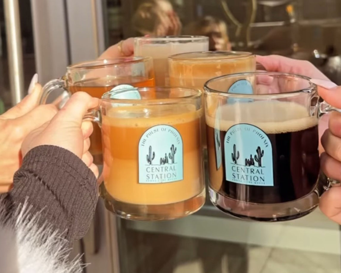 people holding coffee mugs